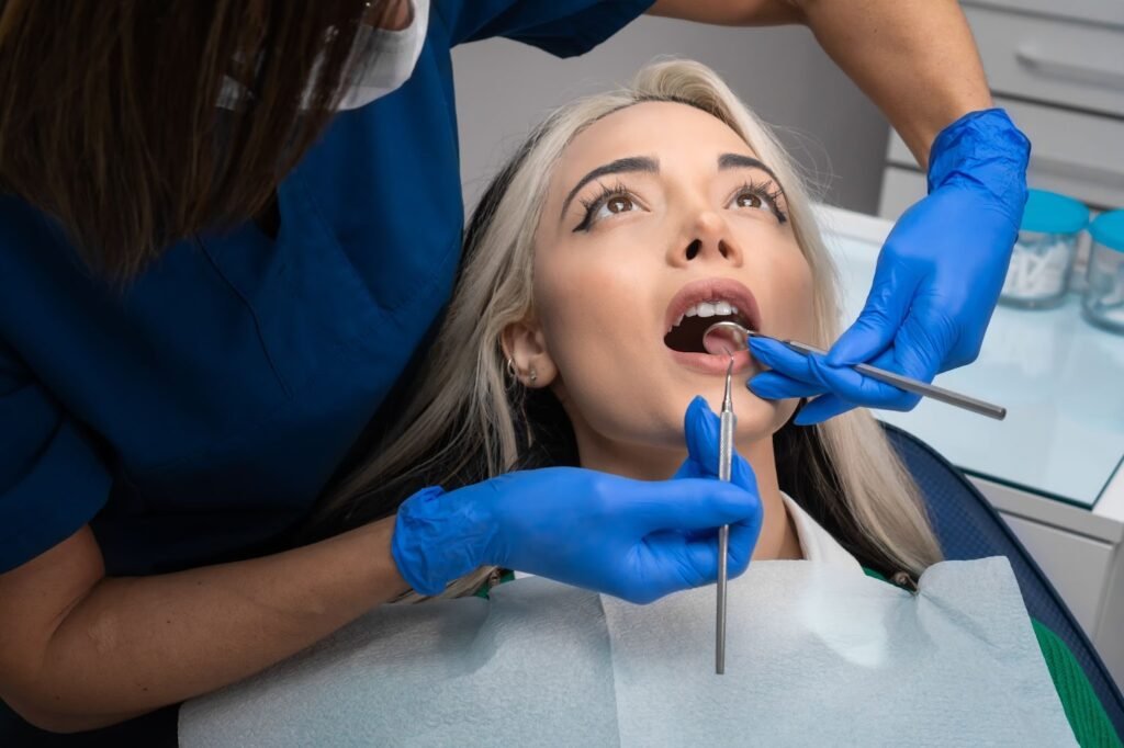 Dentist performing clinical examination for toothache diagnosis in Patna