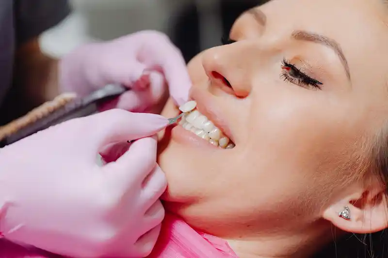 Dentist discussing suitable cosmetic dentistry treatment options with a patient during a consultation in Patna.