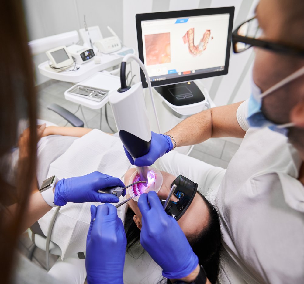 Dentist taking digital impressions for crown and bridge treatment in Patna