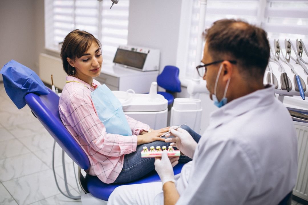 Dentist discussing dental implant treatment options with a patient during an initial consultation in Patna.