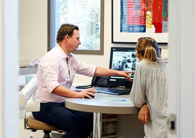 Orthodontist conducting an initial consultation for orthodontic treatment in Patna