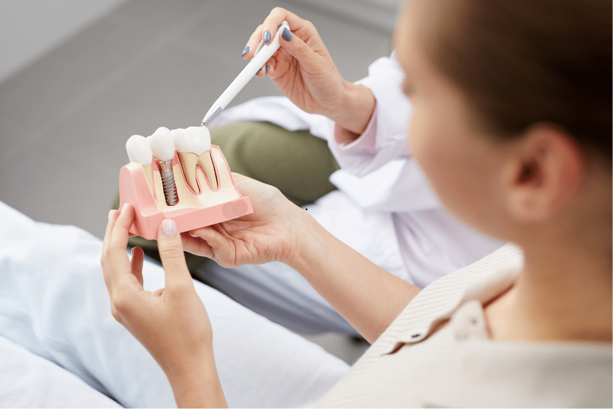 Dentist creating a personalized dental implant treatment plan using digital dental scans and advanced technology for a patient in Patna.